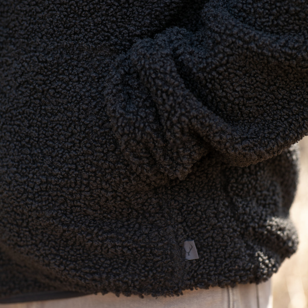 A close-up shows a person wearing the Men&