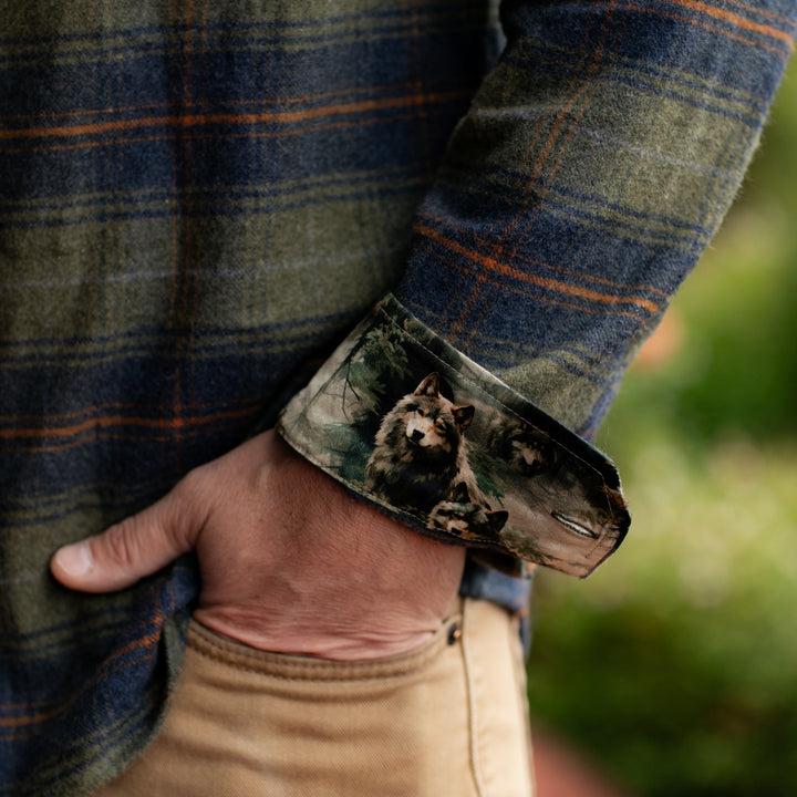 A person in tan pants wears the Men&