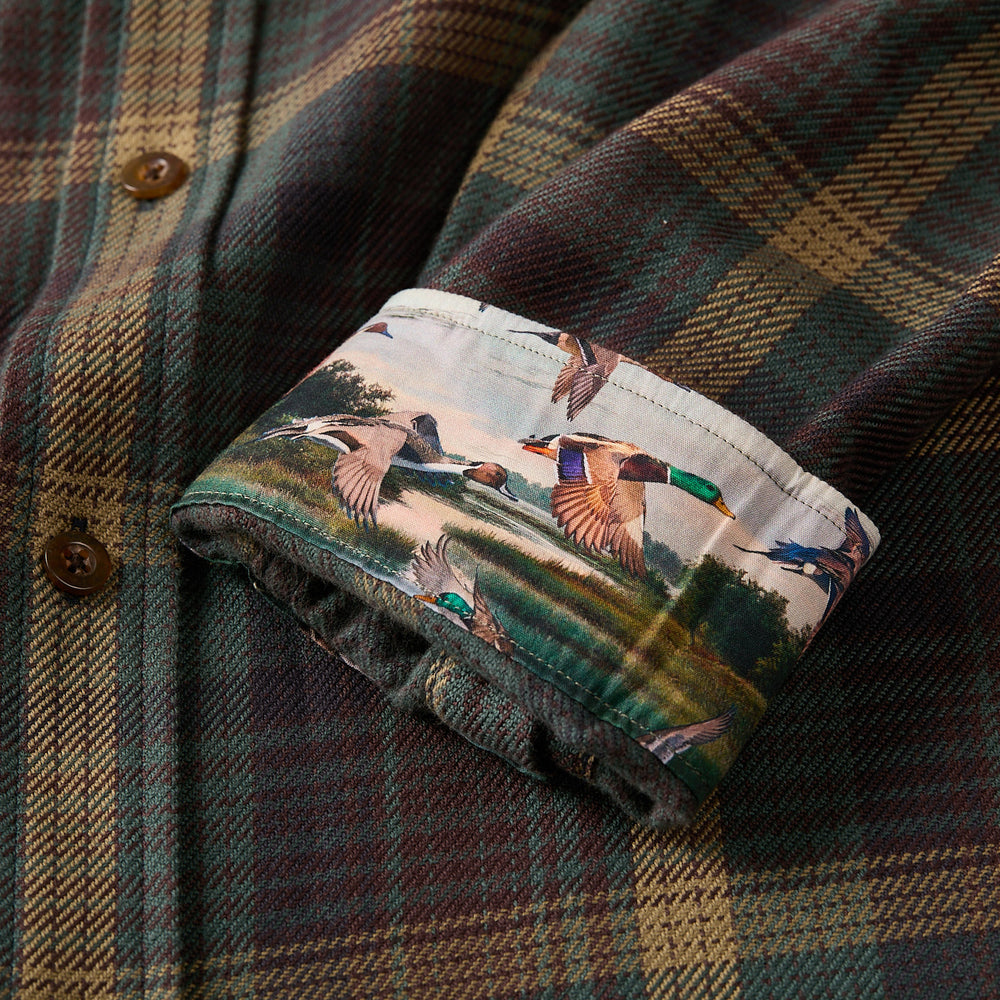 The Pladra Men's Workhorse Elite Flannel Shirt in Birch Brown has rolled cuffs that reveal a colorful duck print lining.