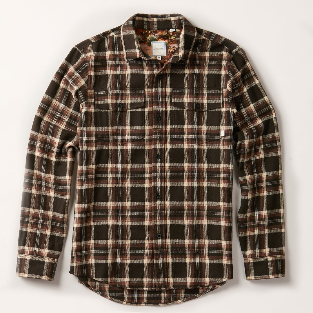 The Men's Workhorse Elite Flannel Shirt- Diamondback Brown features heavyweight Portuguese cotton flannel in a brown, black, and white plaid with two chest pockets and a curved hem—a rugged essential for any wardrobe.