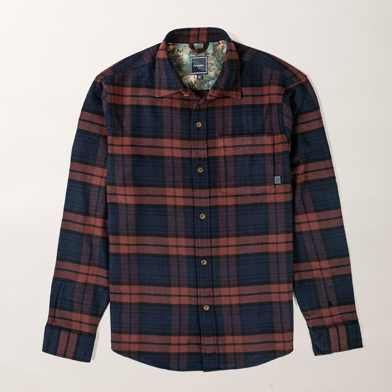 Pladra Men’s Every Day Elite Flannel Shirt in Farallon Blue plaid, chest pocket and collar, laid flat on white background.