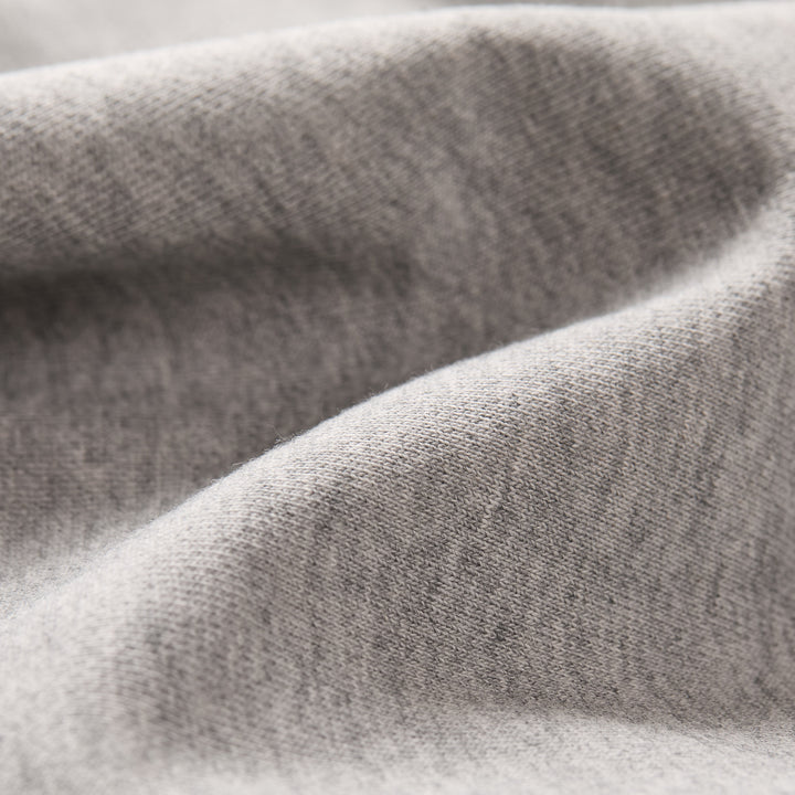 Close-up of Fog Grey Men's Klamath Crew in premium cotton, highlighting its soft, smooth texture, fine knit details, and gentle folds—ideal for those seeking a classic fit sweatshirt with subtle shading.