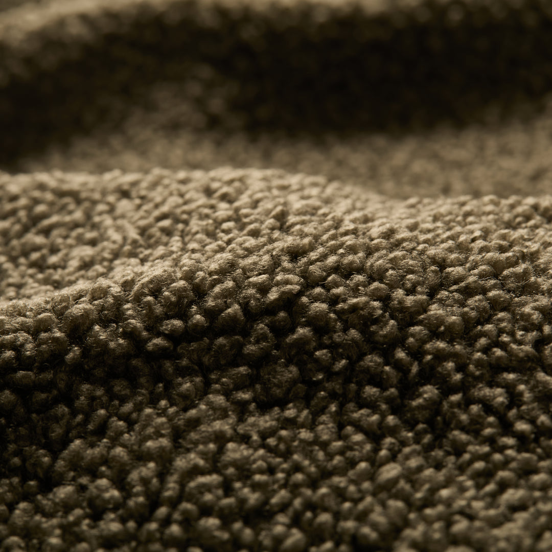 Close-up of the Men's Cypress Sherpa Fleece in Forest Green, highlighting its heavyweight fleece fabric with soft, fuzzy fibers and gentle surface folds.