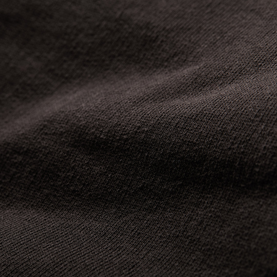 Close-up of Pladra Men's Sierra Hoodie-Charcoal Black, showing heavyweight French terry texture and soft folds.