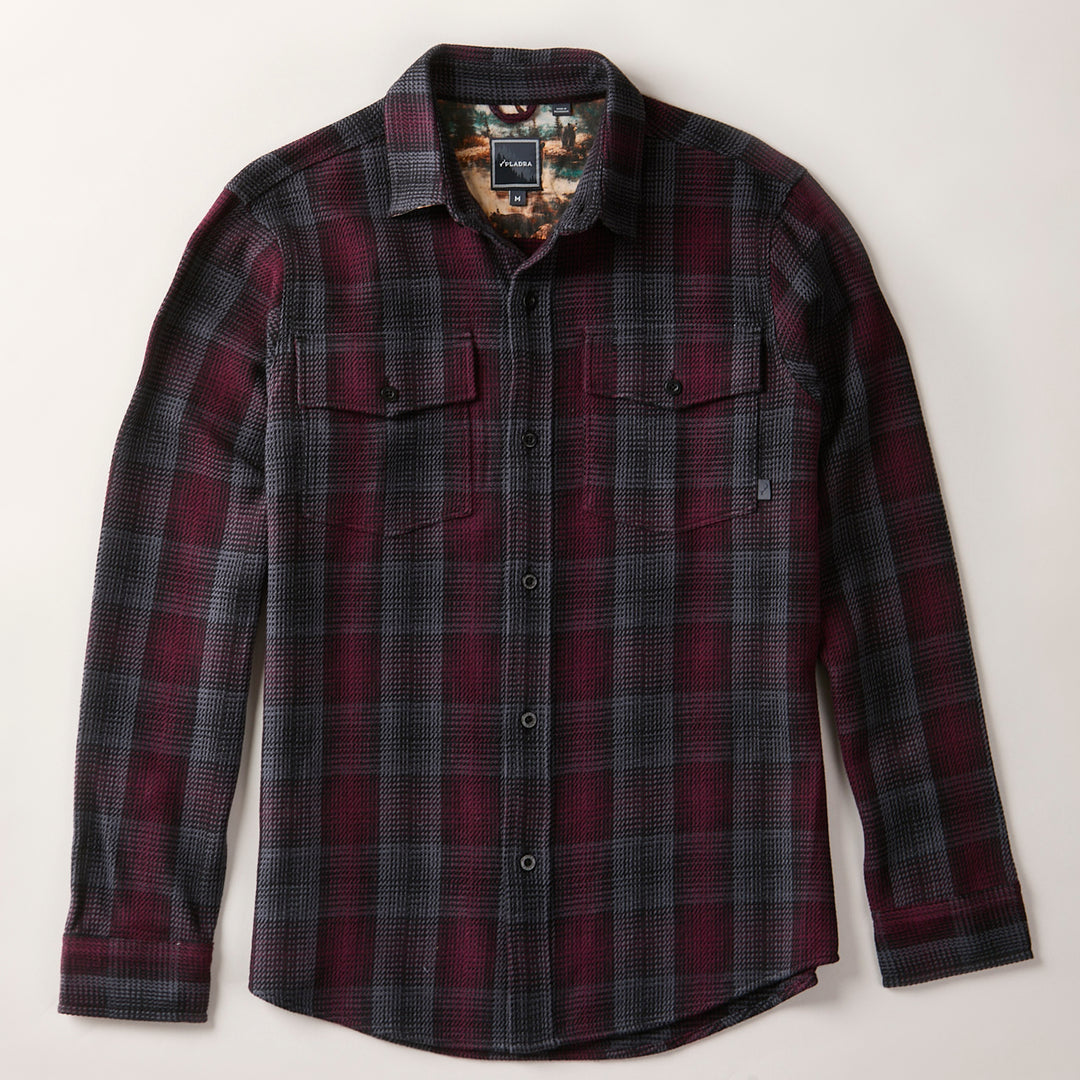 Men's Fireside Flannel - Hickory Red: long-sleeve button-up shirt in black, red, and gray plaid with two chest pockets and a collar, shown laid flat on a light background.