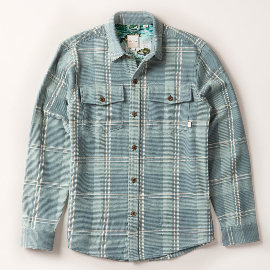 Pladra Men's Fireside Flannel in Island Blue with button front, two chest pockets, and long sleeves on white background.