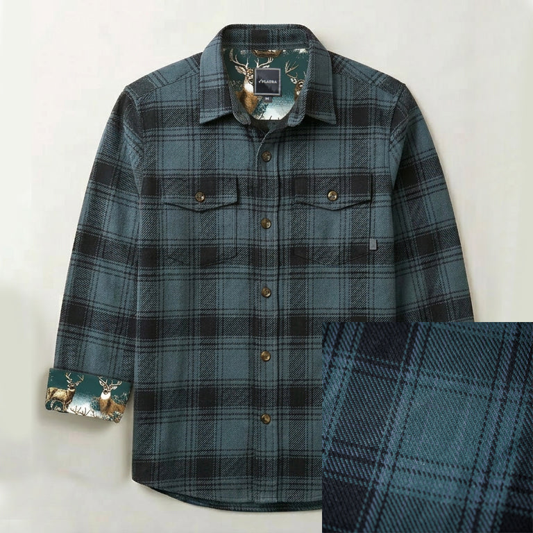 Men's Fireside Flannel in Fjord Green, a green plaid with brown buttons, two chest pockets, and deer-print collar and cuff lining.