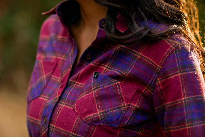 Close-up of a woman outdoors in sunlight wearing the Pladra Women&