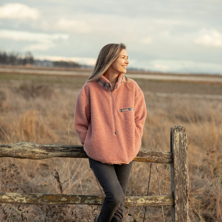 A woman in a coral pink Women&