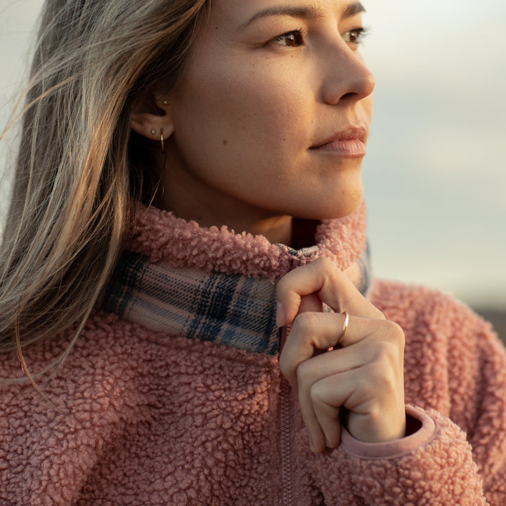 A woman in a coral pink Women&