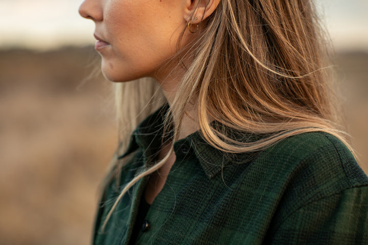 Close-up of a woman with long blonde hair in Pladra’s Women&
