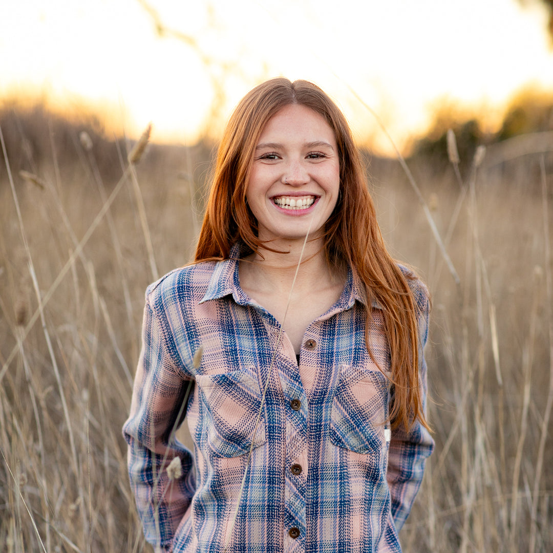 Smiling young woman in a Pladra Women&