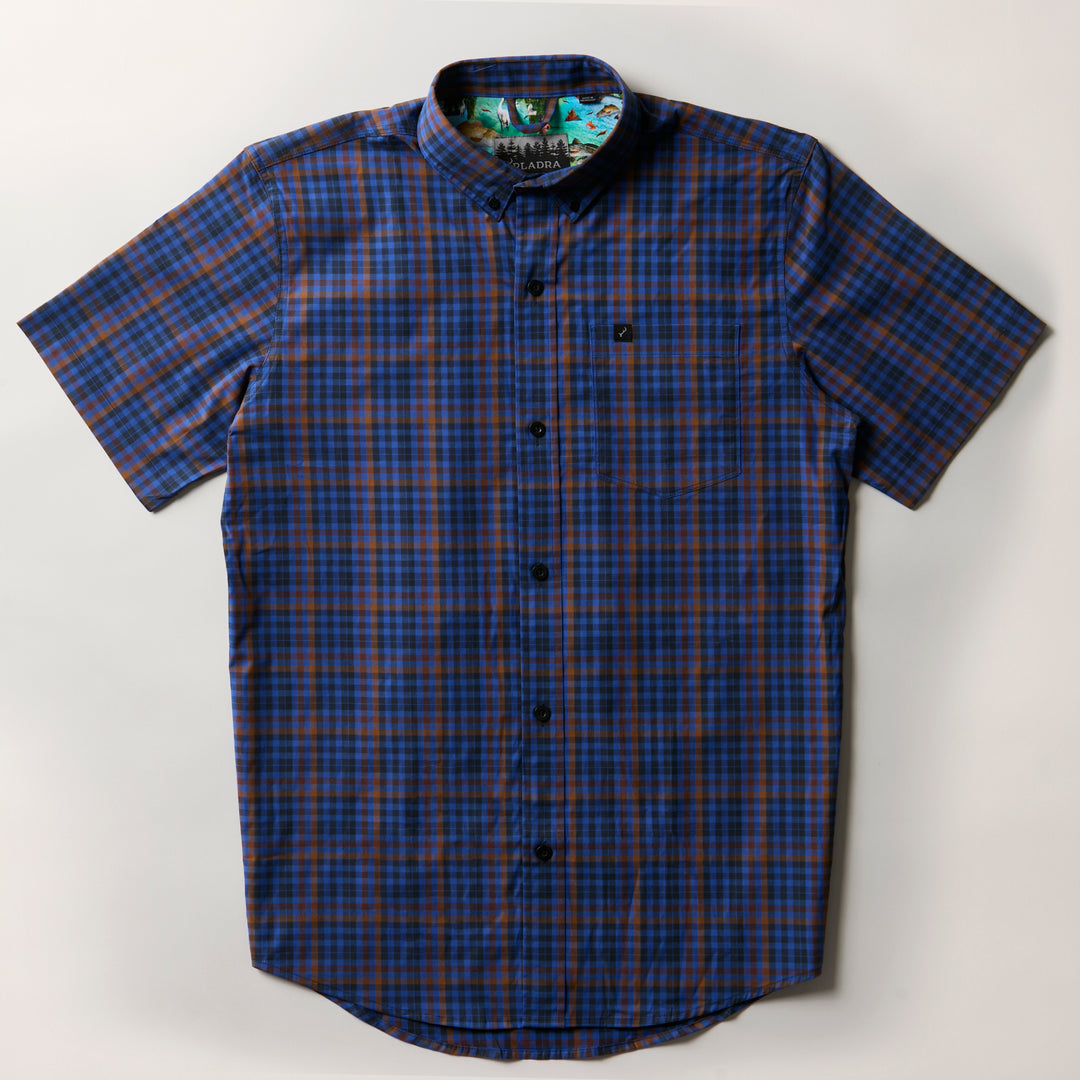 Men's Short Sleeve Tailwinds Shirt by Pladra in Lagoon Blue plaid, with chest pocket, shown laid flat on white.