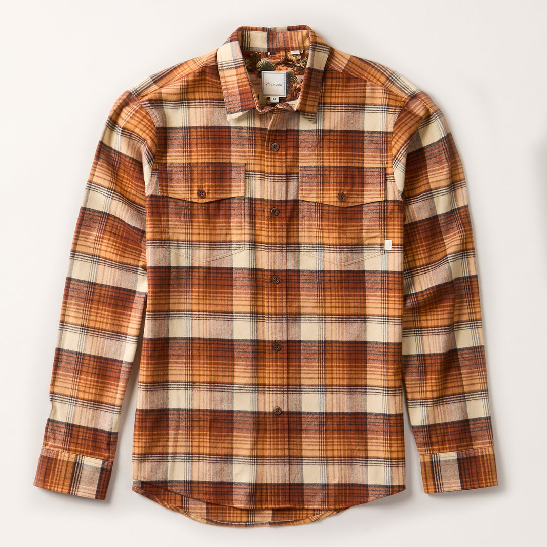 The Men's Workhorse Flannel Shirt—Sedona Orange is a heavyweight, long-sleeve button-up in premium Portuguese flannel with a brown, cream, and orange plaid pattern, two chest pockets, and a collar. Laid flat on a light background.
