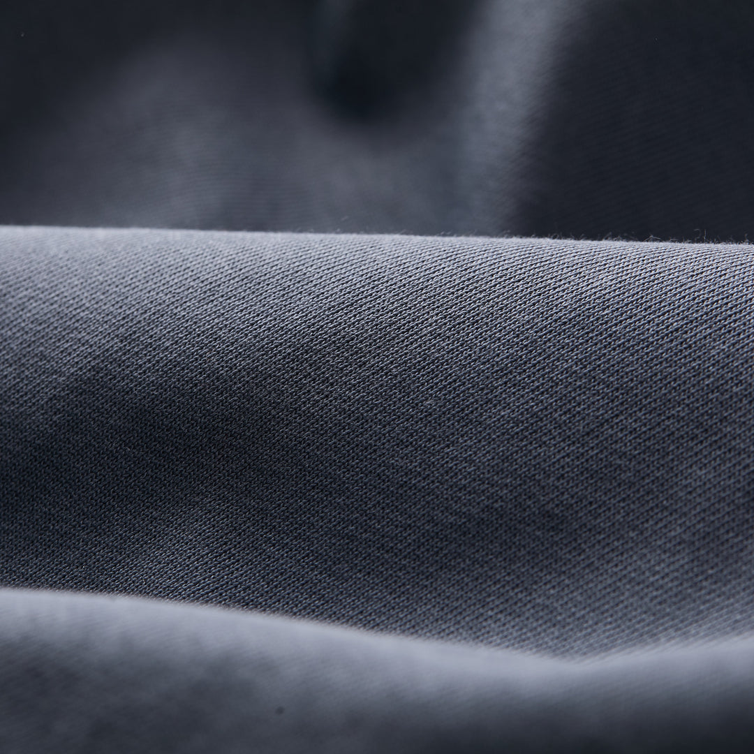 Close-up of Pladra Men's Klamath Crew in Stone Blue, showing its soft, smooth, premium cotton fabric with subtle texture.
