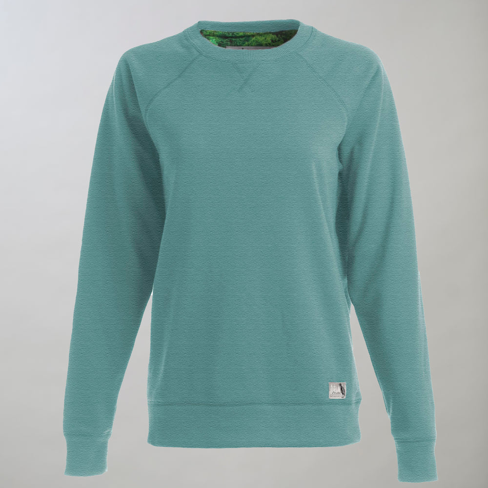 The Women's Crew Neck Sweatshirt in Bermuda Green Heather, shown on a neutral background, features slim fit styling, ultra soft fleece with textured fabric, long sleeves, and a small white tag near the bottom hem.