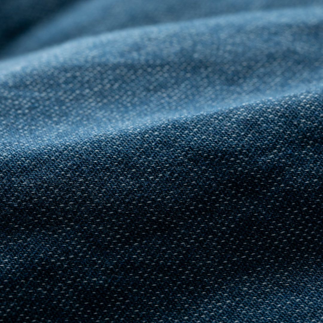 Close-up of blue Biscayne Blue Twill fabric showcases detailed weave texture and subtle folds, as featured in the Women&