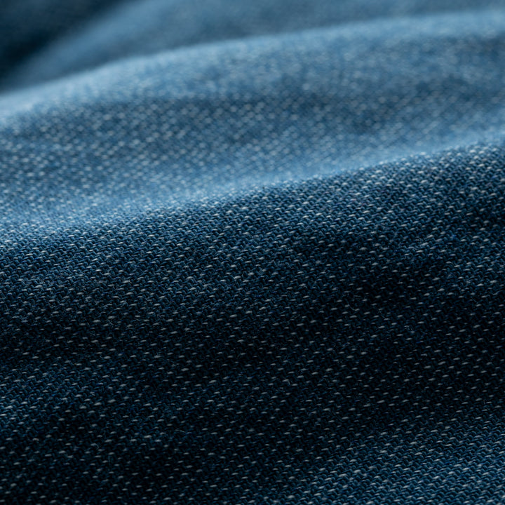 Close-up of blue Biscayne Blue Twill fabric showcases detailed weave texture and subtle folds, as featured in the Women&