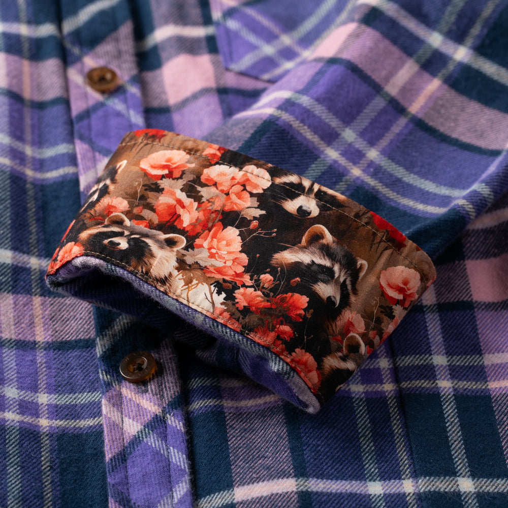 Close-up of Pladra Women's Every Day Flannel Shirt-Blackberry Purple cuff lined with raccoon and floral fabric.