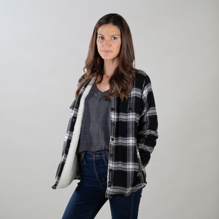 A woman with long brown hair wears the Pladra Women&