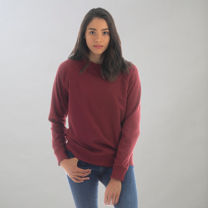A young woman with medium-length dark hair wears the Women&