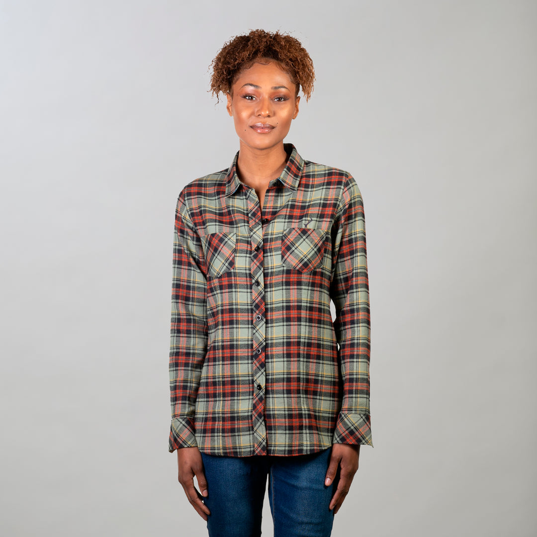 A woman faces forward in a Pladra Women's Every Day Double Weave Shirt - Sea Foam Green and jeans, on a plain background.