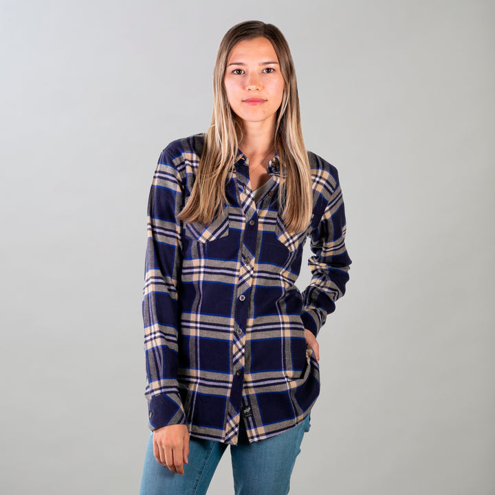 A woman with long, straight hair stands against a plain background, wearing the Women&