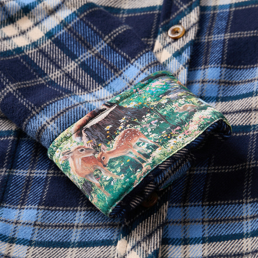 Pladra Women's Every Day Elite Flannel Shirt in Bighorn Blue features heavyweight cotton and a hidden deer forest print cuff.