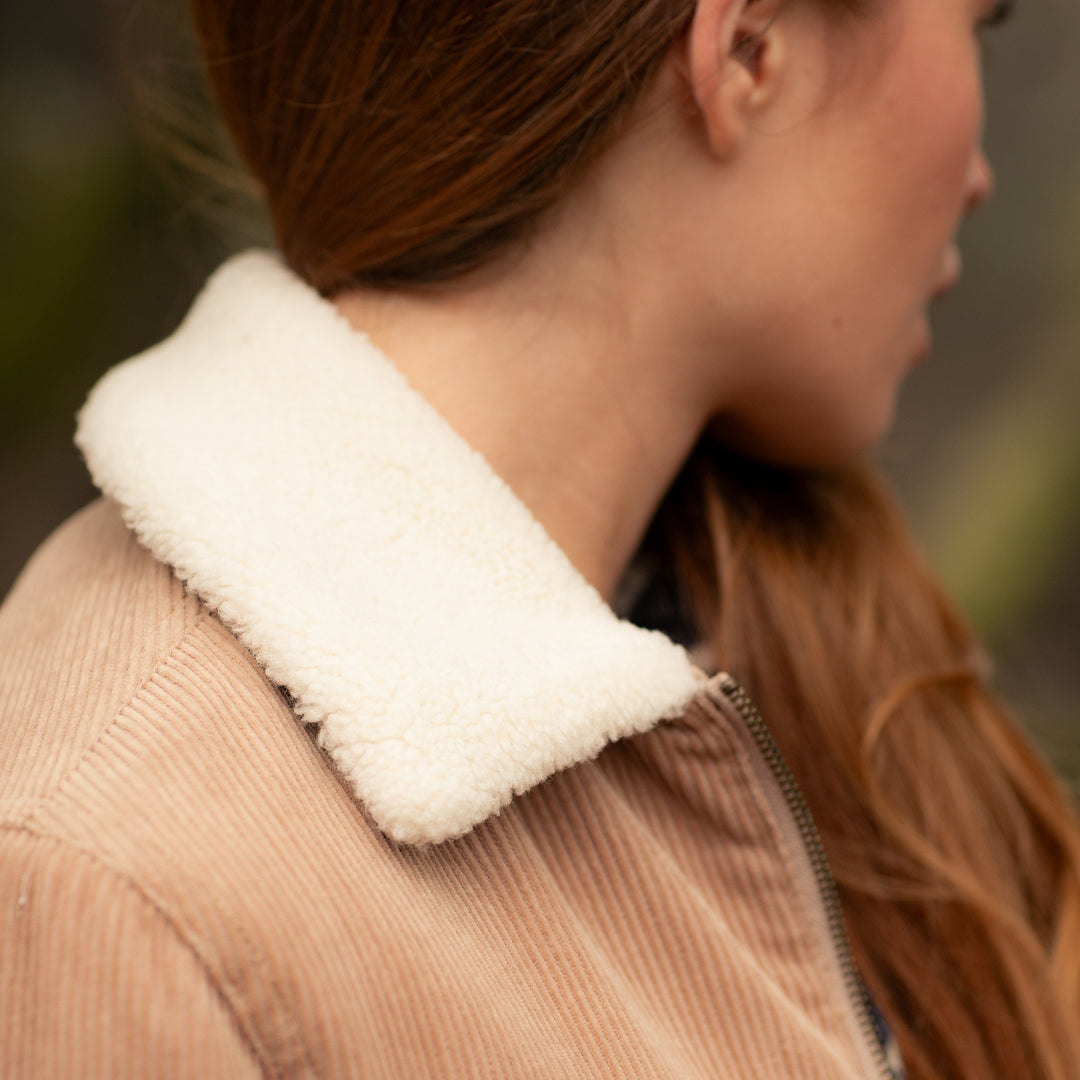 Close-up of a person with long brown hair wearing the Pladra Women&