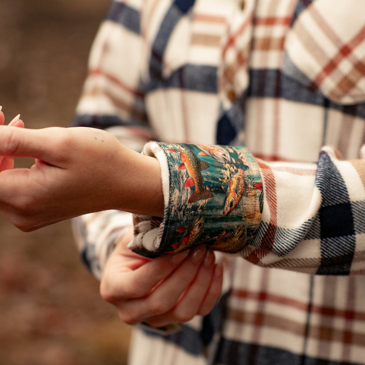 A woman adjusts the cuff of the Women&