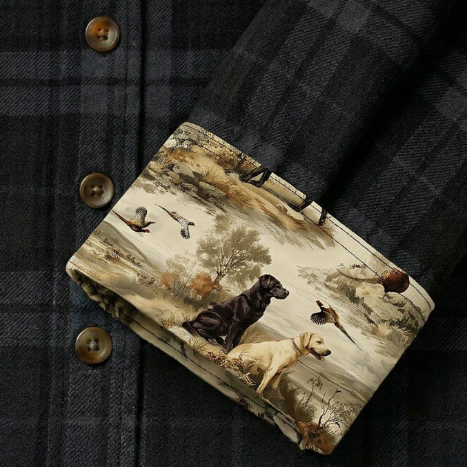 Women's Fireside Flannel in Night Black by Pladra features cuffs with a landscape print of dogs and birds near water.