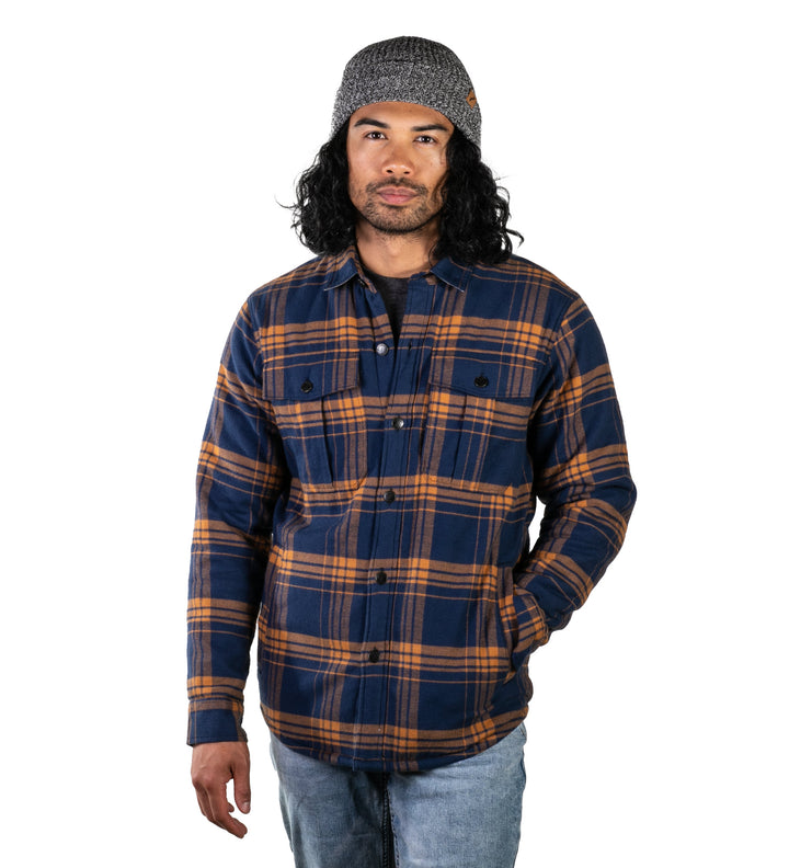 A person with long, dark hair wears the Men&