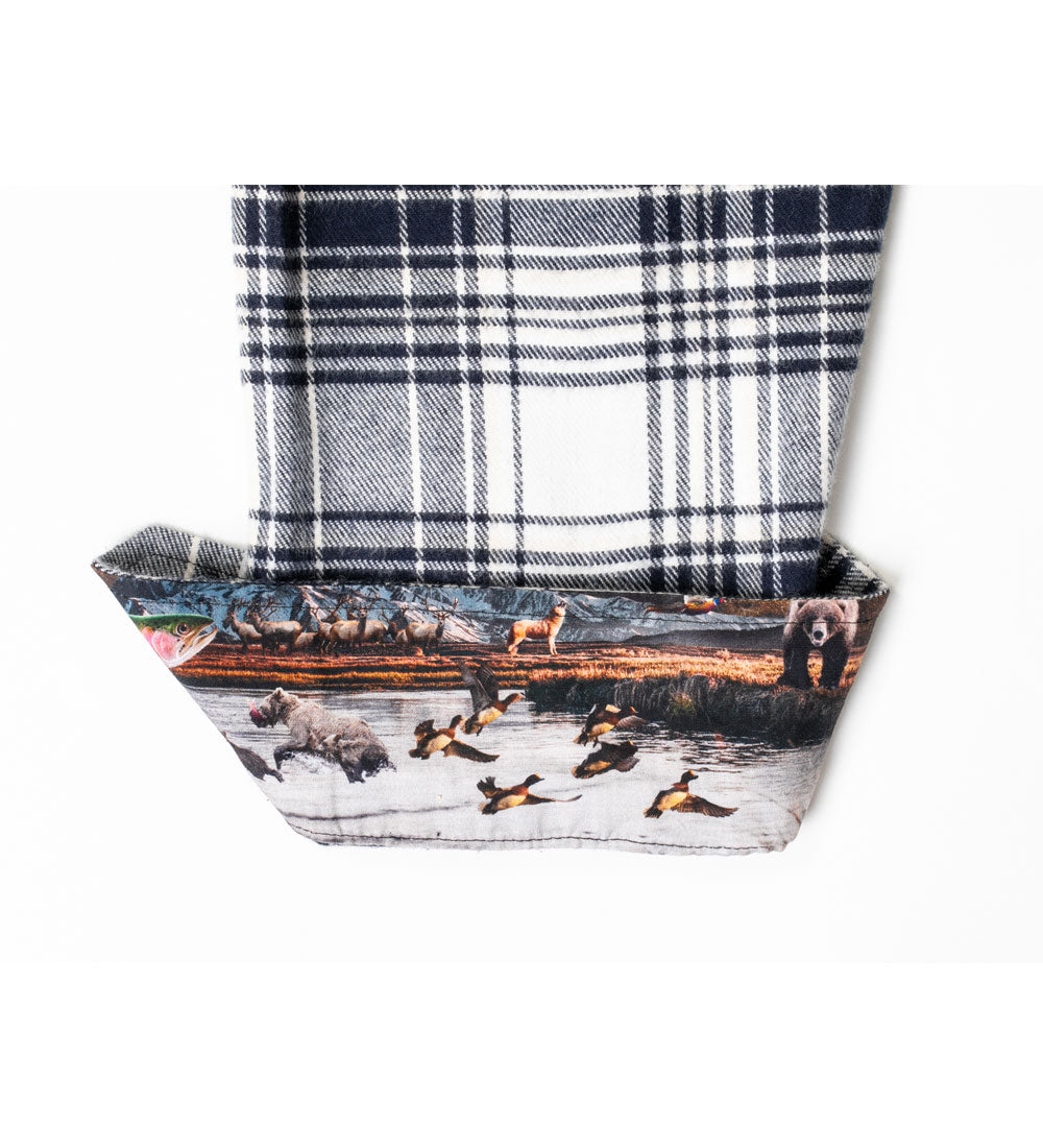 Pladra Women's Every Day Flannel Shirt in Butte Blue with cuffs featuring bears, wolves, and birds in a wildlife scene.