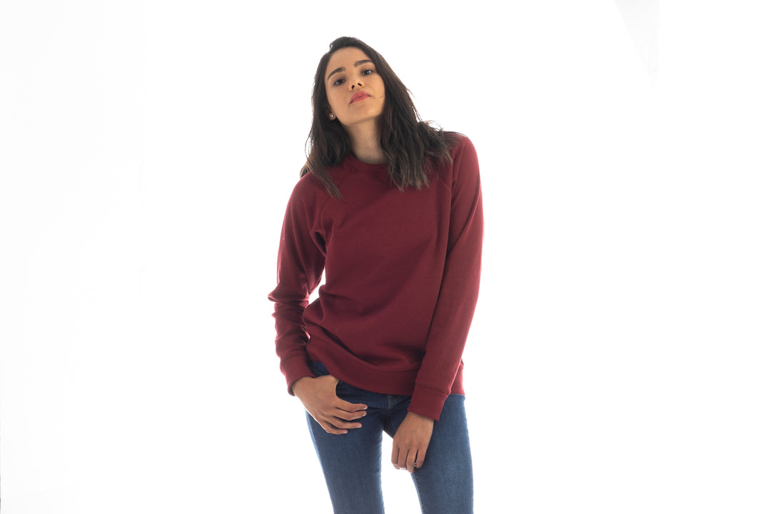 A woman with long dark hair wears a Pladra Women&