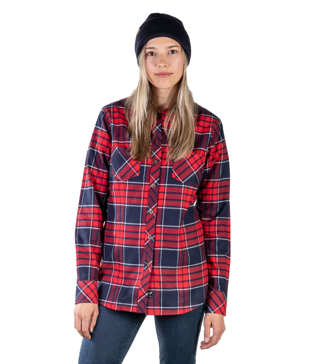 A person with long blonde hair wears a black beanie, blue jeans, and the Women&